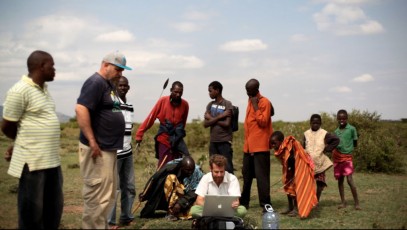Aviram and Yoav feeding GPS information to the computer to create a map of Sadhana Forest Kenya