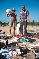 Volunteers at clothing dump - collecting unusable clothes for water conservation