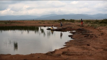 Women collecting water 1km from Sadhana Forest Kenya land