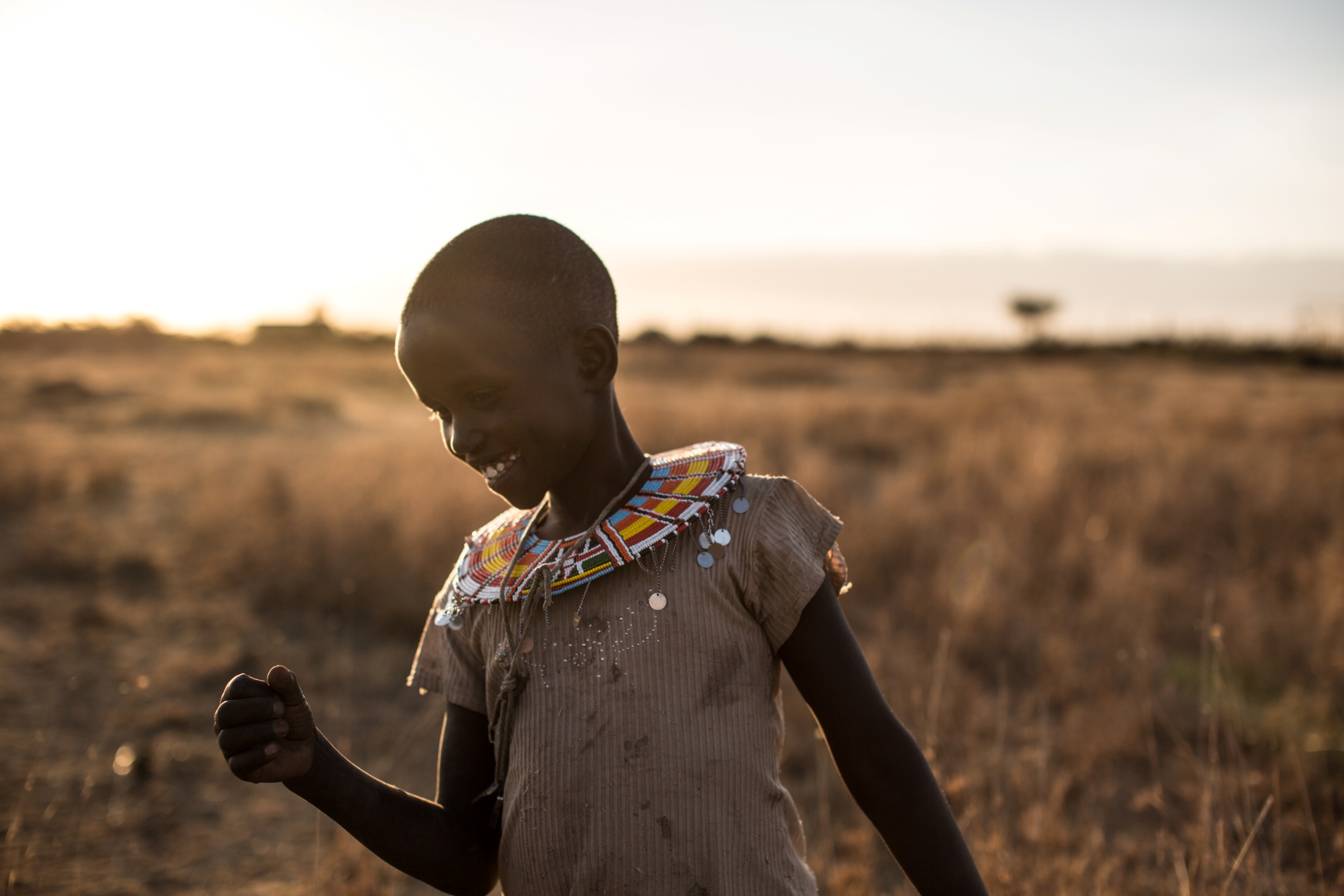 Young Samburu girl in dry grassland
