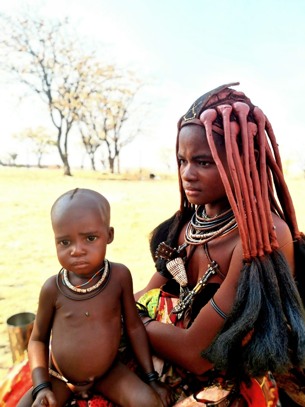 Young Himba mother with child